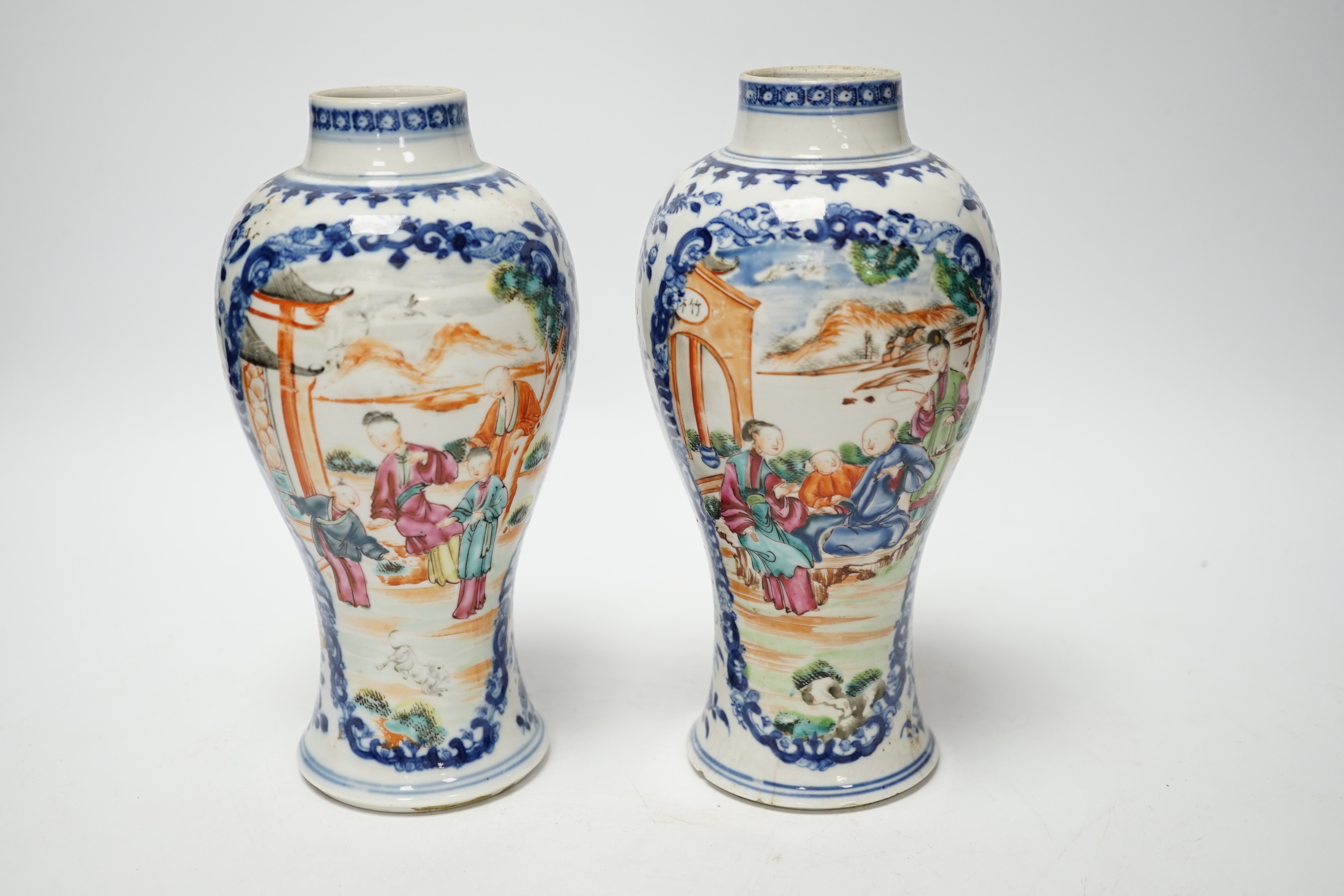A pair of late 18th century Chinese famille rose ‘mandarin’ vases, 19cm high